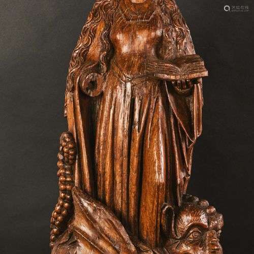 Sainte Marguerite en chêne sculpté, dos creusé. La…
