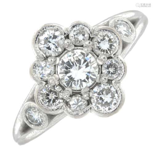 A brilliant-cut diamond cluster ring.