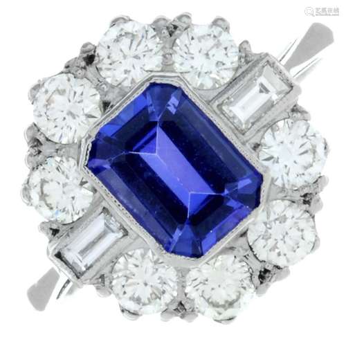 A tanzanite ring, with baguette-cut diamond sides and brilli...