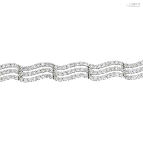A brilliant-cut diamond undulating bracelet.,