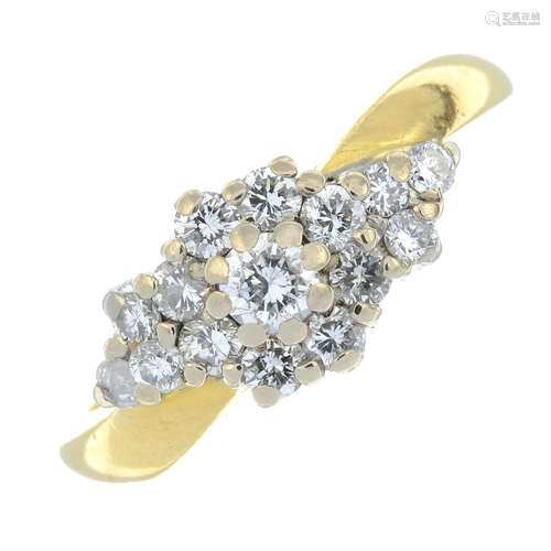 An 18ct gold brilliant-cut diamond cluster ring.Estimated to...