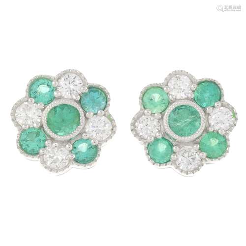 A pair of 18ct gold emerald and brilliant-cut diamond floral...