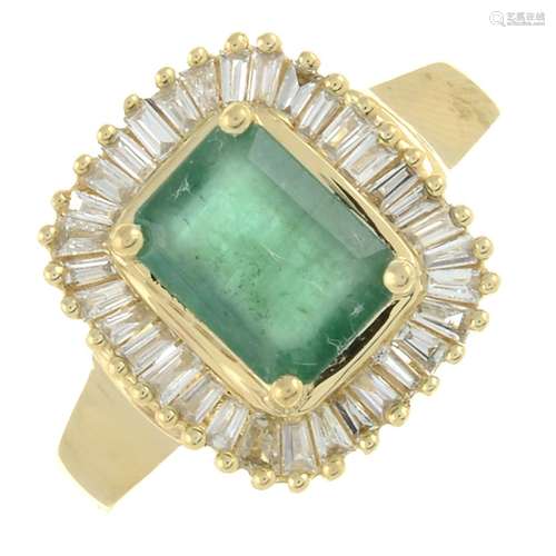 An emerald and baguette-cut diamond cluster ring.