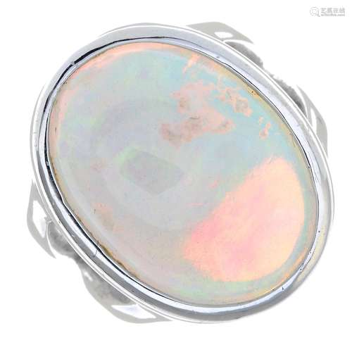 An opal cabochon single-stone ring.approximate dimensions of...