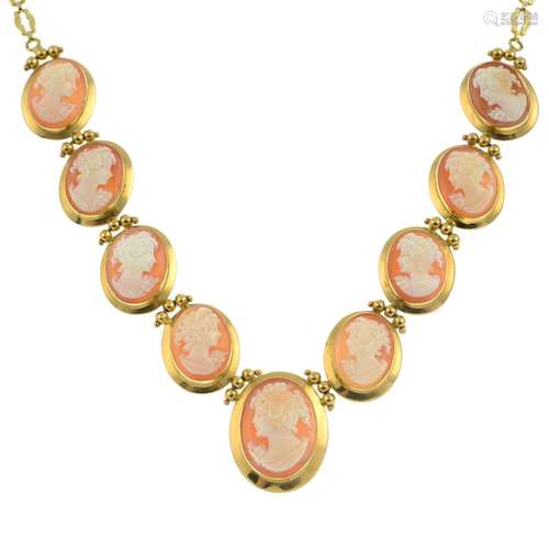 A graduated cameo necklace, with fancy-link back chain.Stamp...