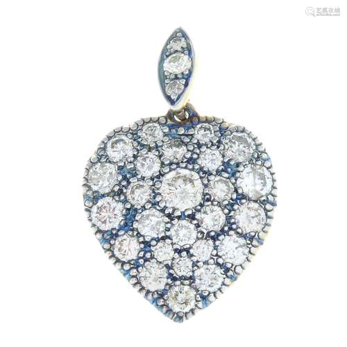 A brilliant-cut diamond heart-shape cluster pendant.Estimate...