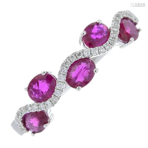 An 18ct gold ruby and brilliant-cut diamond undulating band ...