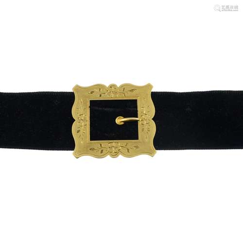 A black velvet choker necklace,