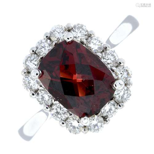 A garnet and brilliant-cut diamond cluster ring.Garnet weigh...