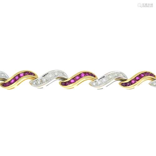 An 18ct bi-colour gold ruby and brilliant-cut diamond scroll...