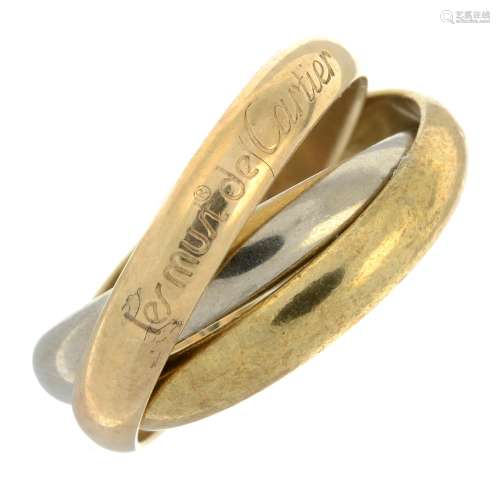 A 'les must de Cartier' trinity ring, by Cartier.Signed Cart...