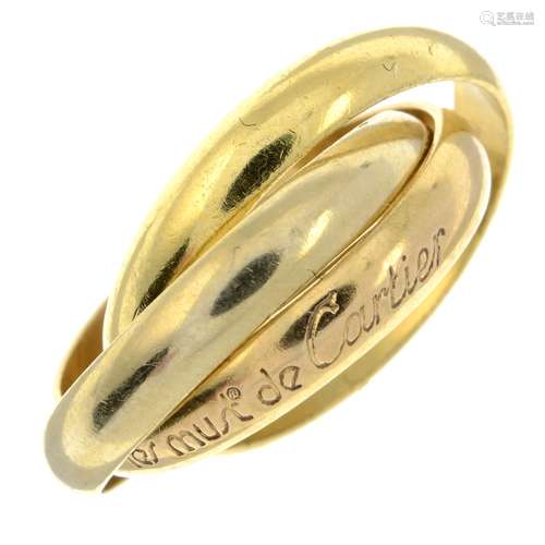 A 'les must de Cartier' trinity ring, by Cartier.Signed Cart...