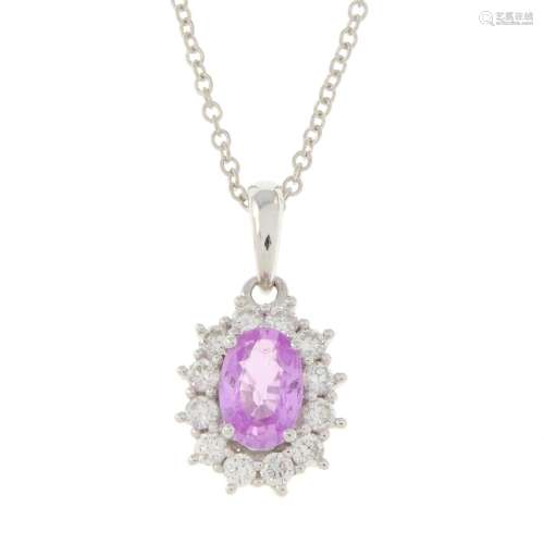 An 18ct gold pink sapphire and diamond cluster pendant, with...