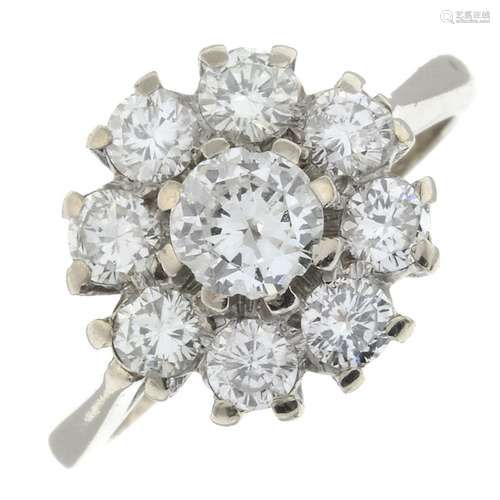 A brilliant-cut diamond cluster ring.