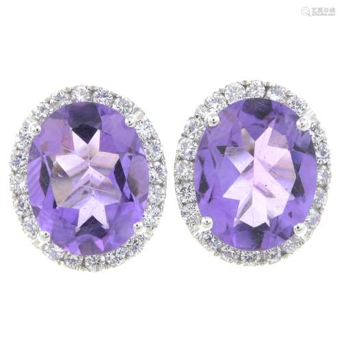 A pair of amethyst and brilliant-cut diamond cluster earring...