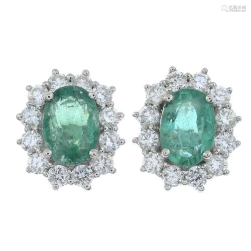 A pair of 18ct gold emerald and brilliant-cut diamond cluste...
