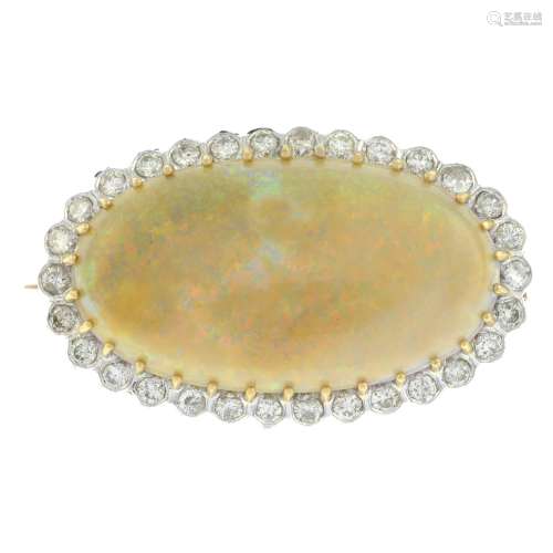 An opal cabochon and brilliant-cut diamond cluster brooch.Ma...