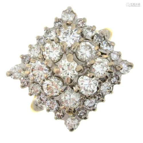 An 18ct gold brilliant-cut diamond cluster ring.Estimated to...