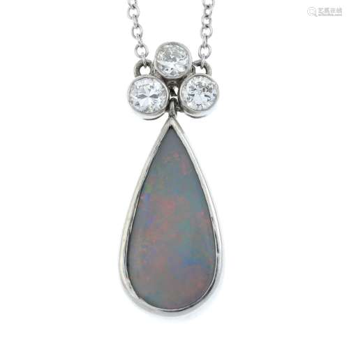 An opal cabochon and brilliant-cut diamond pendant,