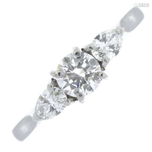 A platinum brilliant-cut and pear-shape diamond three-stone ...