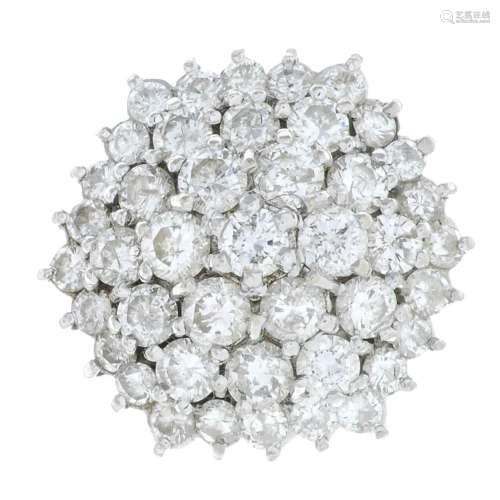 An 18ct gold brilliant-cut diamond cluster ring.Estimated to...