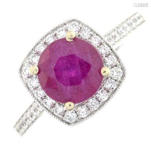 A ruby and brilliant-cut diamond cluster ring.Ruby is glass-...