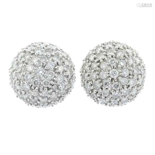 A pair of 9ct pave-set diamond cluster earrings.Estimated to...