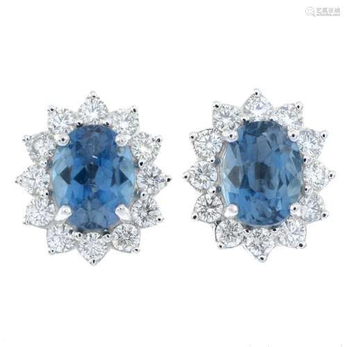 A pair of blue topaz and brilliant-cut diamond cluster earri...