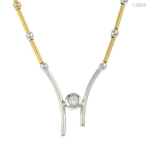 A brilliant-cut diamond single-stone bi-colour necklace.Esti...