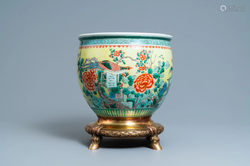 A Chinese famille verte jardiniere on a dated gilt