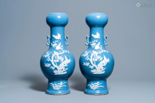A pair of Chinese white slip-decorated blue-ground