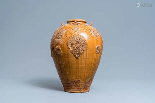 A Chinese brown-glazed relief-molded martaban jar with