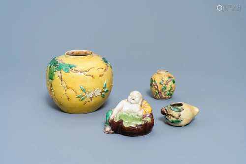 Two Chinese yellow and verte biscuit jars, a Buddha