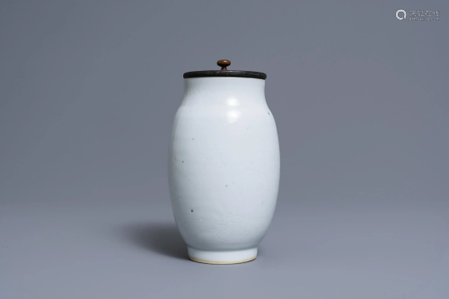 A Chinese monochrome white vase with an incised design