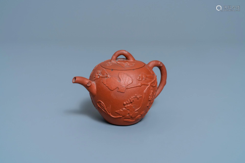 A Chinese Yixing stoneware teapot with squirrels among