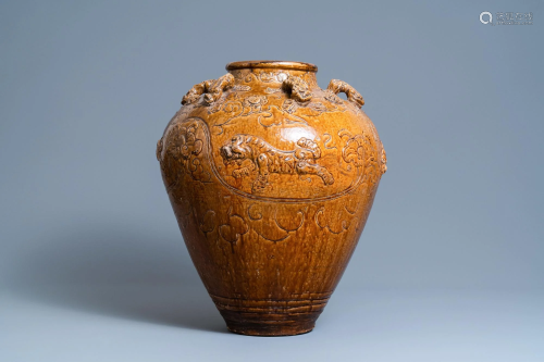 A large Chinese brown-glazed relief-molded martaban jar