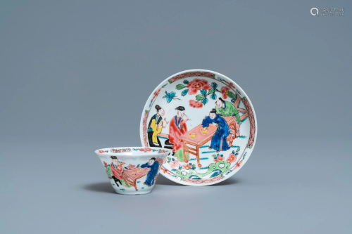 A Chinese famille rose 'tea scene' cup and saucer,