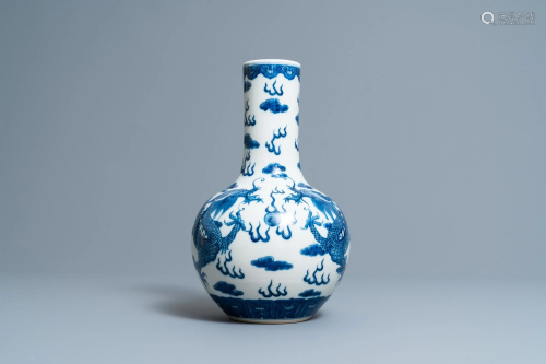 A Chinese blue and white 'dragons' bottle vase,