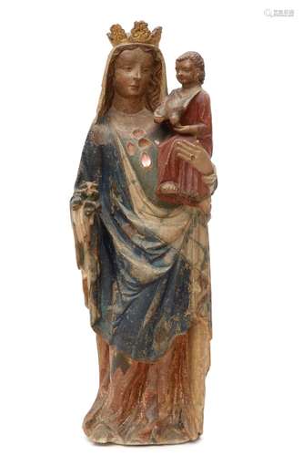 A French carved and polychrome painted stone figure of the V...