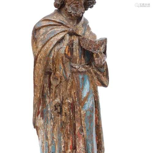 A carved and polychrome painted wooden figure of Saint Peter