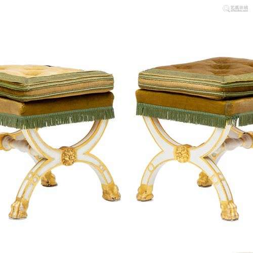 A pair of French white painted and parcel-gilt stools