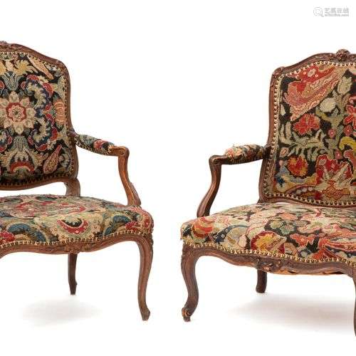 A near pair of Louis XV beechwood fauteuils
