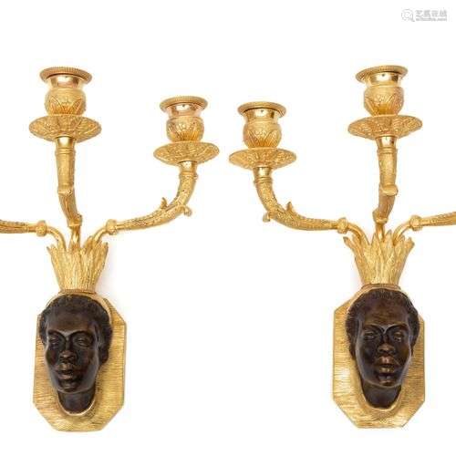 A pair of French ormolu and patinated bronze wall appliques