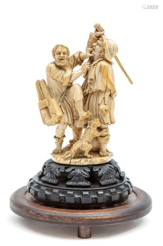 A carved ivory group of two fighting beggars and a dog