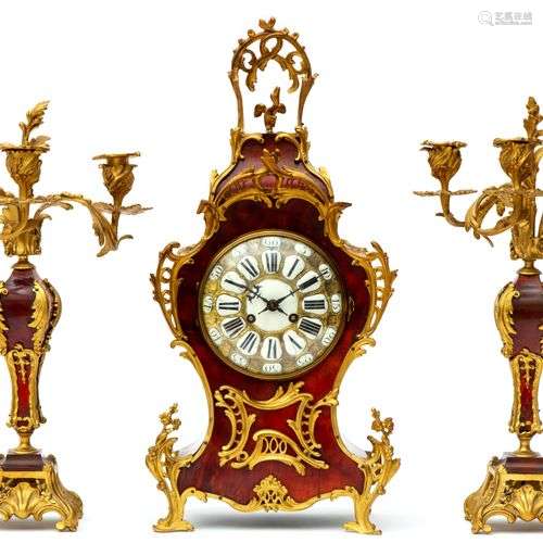 A French ormolu and tortoiseshell three-piece clock garnitur...