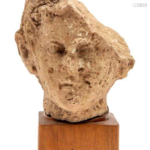 A Roman stone carved head (fragment)