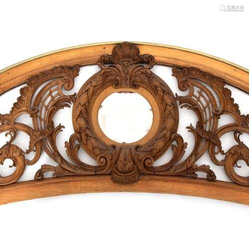 A large French pierced and carved oak overdoor panel