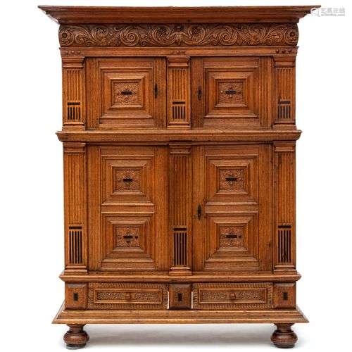 A Dutch carved oak four-door cupboard