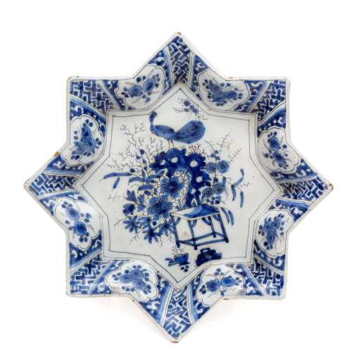 A Dutch Delft blue and white pottery star shaped dish