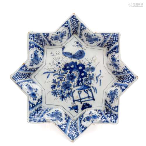 A Dutch Delft blue and white pottery star shaped dish